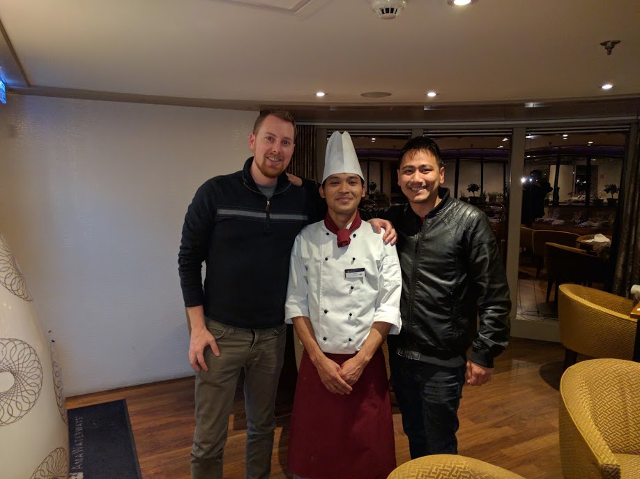 From the Left: Matt, Chef's Table Chef, Jason. The chef is wearing a typical cooking outfit with a tall white hat. He is from Indonesia